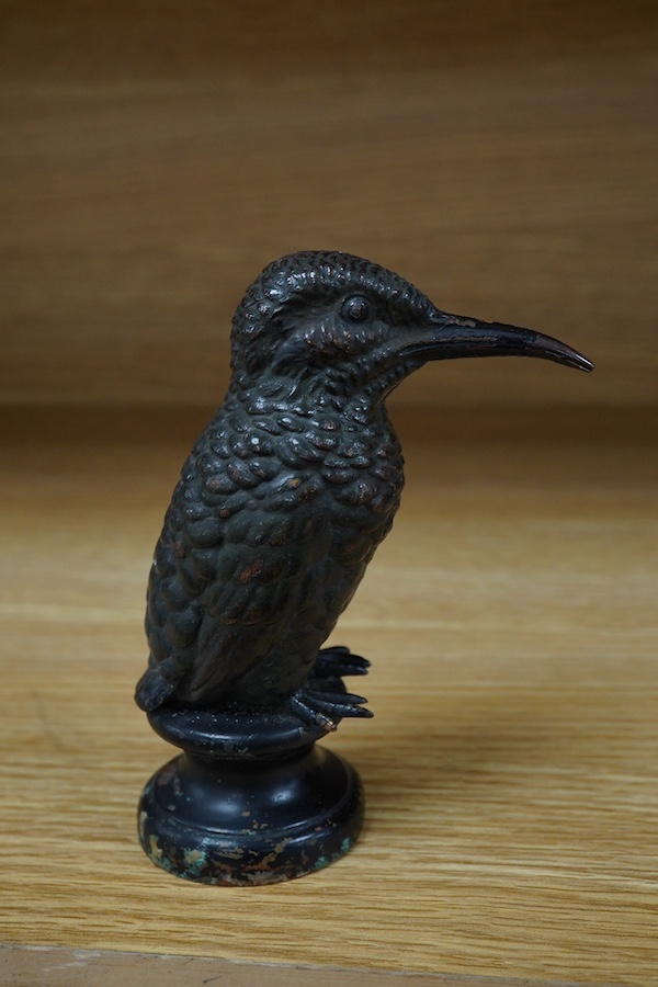 A cold painted bronze car mascot in the form of a kingfisher mounted on a circular socle, 12.5cm high. Condition - fair.